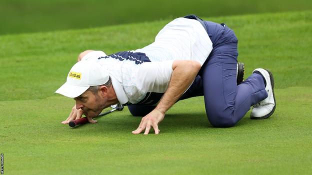 Stuart Manley reads a putt in his trademark crouching style