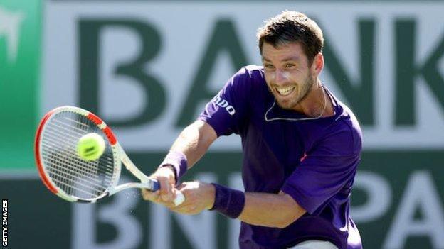 Cameron Norrie returns a backhand