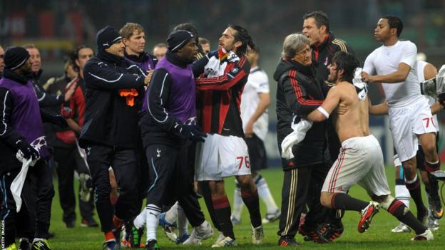 A shirtless Gennaro Gattuso is held back after clashing with Joe Jordan at full-time