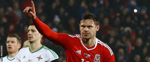 Simon Church celebrates scoring for Wales