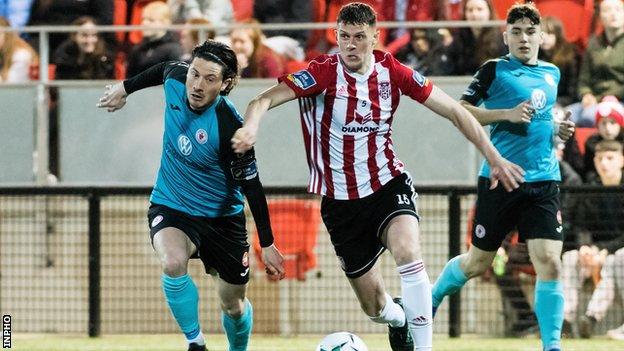 Derry's Eoin Toal attempts to burst away from Sligo's Ronan Coughlan at the Brandywell