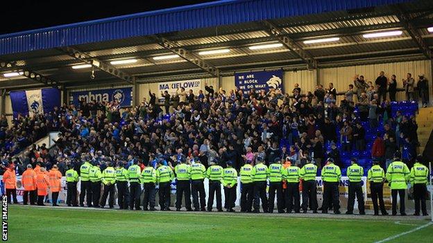Police in front of the fans in a match between Chester and Wrexham in September 2014