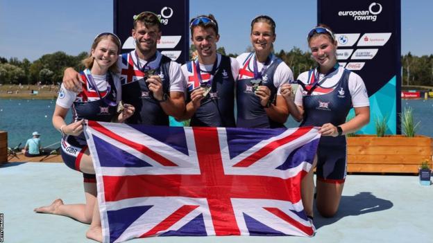 Erin Kennedy with her mixed coxed four crew after winning gold at the European Championships in 2022