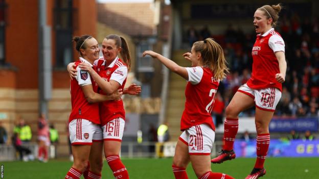 Arsenal women celebrate after scoring against Tottenham