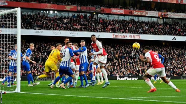 Gabriel Jesus heads in Arsenal's opening goal against Brighton
