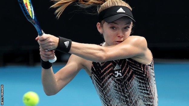 Katie Swan plays a backhand in Australian Open qualifying