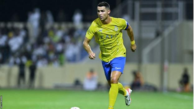 Al-Nassr's Cristiano Ronaldo runs with the ball against Al Fateh in the Saudi Pro League