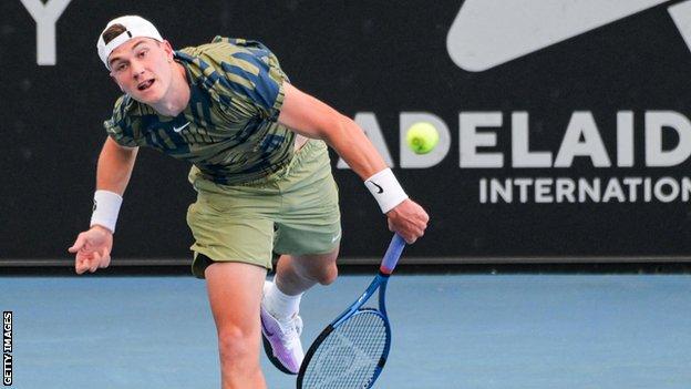 Jack Draper hits a serve at the Adelaide International in January