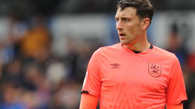 Tommy Elphick: Huddersfield Town defender to have knee surgery