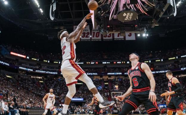 Jimmy Butler shoots and scores for the Miami Heat