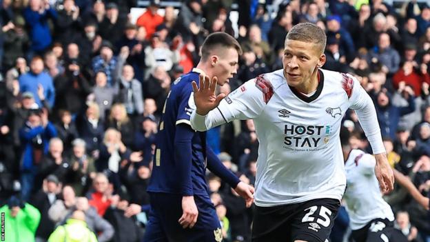 Dwight Gayle celebrates his first goal for Derby County