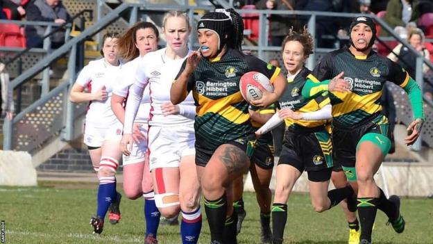 Ranni Samuda with the ball for Jamaica in the game against England Deaf
