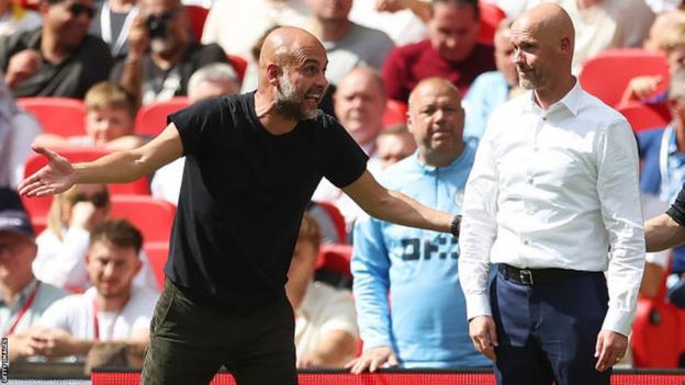 Pep Guardiola and Erik ten Hag speak on the touchline during the FA Cup final