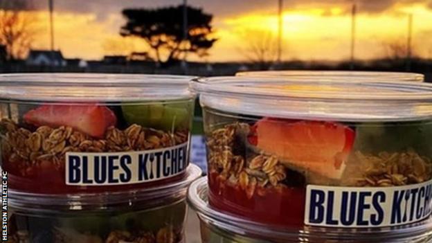 Helston Athletic's players receive granola pots for long away journeys