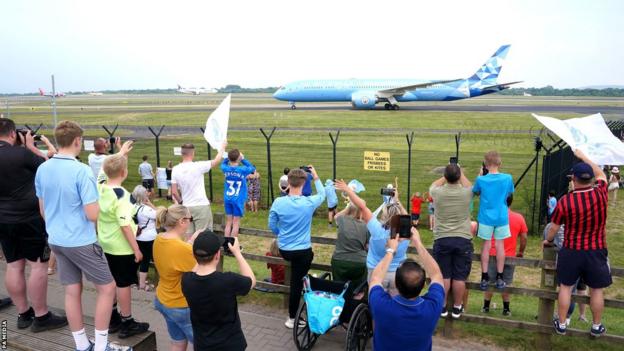 Manchester City's plane lands at Manchester Airport