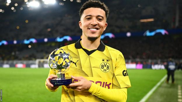 Jadon Sancho poses with Player of the Match trophy after Borussia Dortmund beat PSV Eindhoven in the Champions League