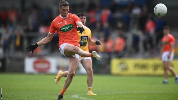 Armagh's Connaire Mackin gets in a shot in the Ulster SFC contest against Antrim in 2021