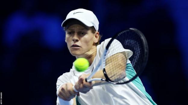 Jannik Sinner plays a backhand in his semi-final against Daniil Medvedev in the ATP Finals