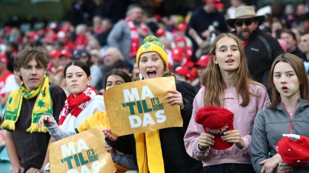 Fans watch the Matildas following the round 22 AFL match between Sydney Swans and Gold Coast Suns at Sydney Cricket Ground