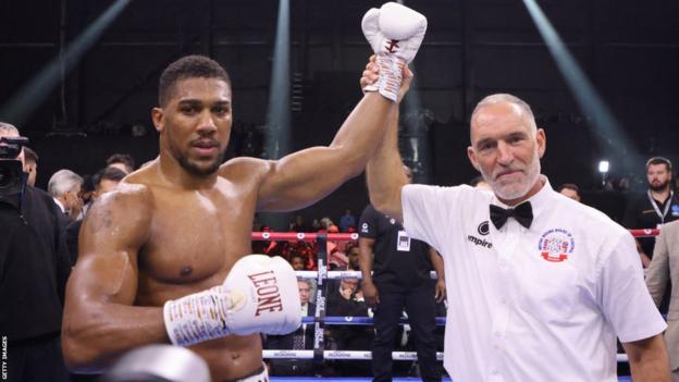Britain's Anthony Joshua celebrates after defeating Sweden's Otto Wallin