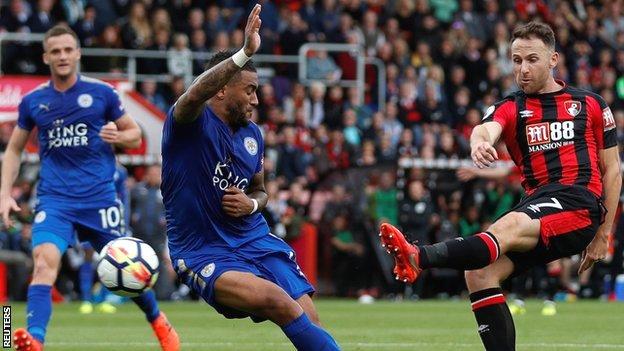 Danny Simpson (left) appears to block Marc Albrighton's shot with his hand