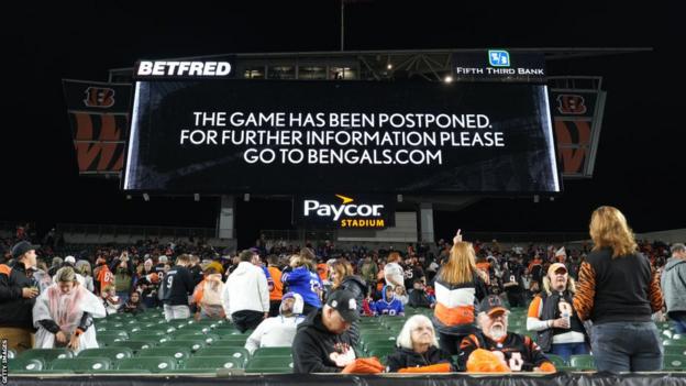 A big screen at Cincinnati Bengals reads: "The game has been postponed"