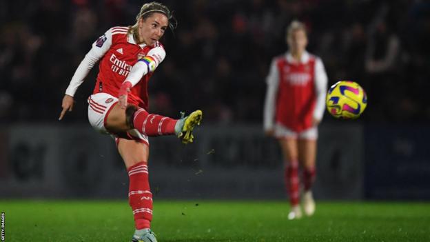 Jordan Nobbs kicks a ball