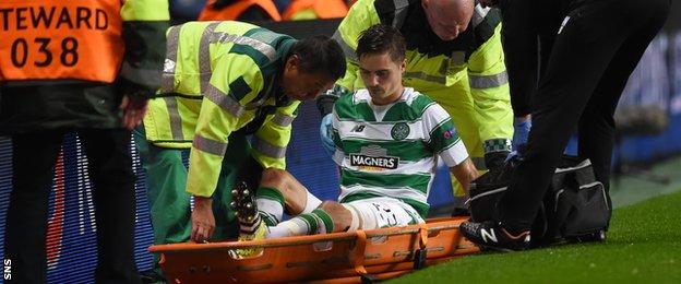 Celtic defender Mikael Lustig is stretchered off
