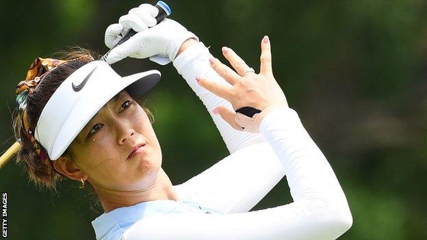 Michelle Wie playing with her right hand heavily strapped during a tournament in February