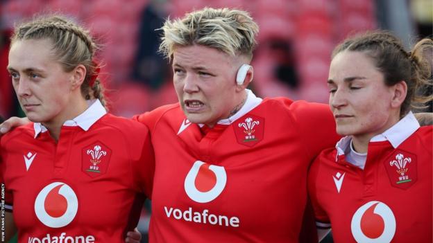 Hannah Jones (left) with Donna Rose (centre) and Jasmine Joyce (right) following defeat to Ireland