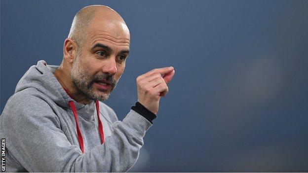 Pep Guardiola gesticulates