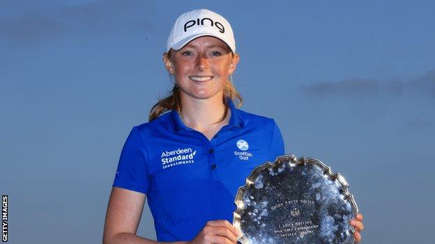 Louise Duncan lifts the Smyth Salver for finishing the leading amateur at the Women's Open