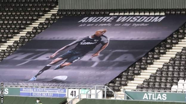 A flag in support of Andre Wisdom