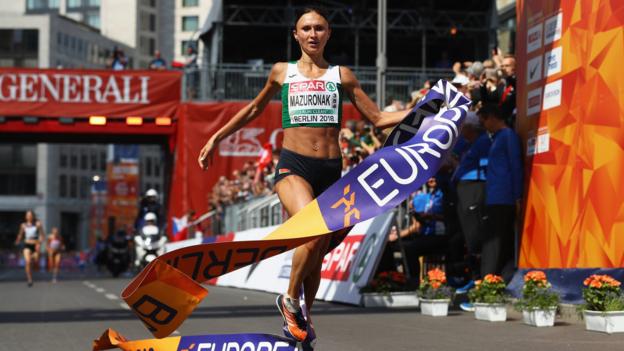 BERLIN, GERMANY - AUGUST 12: Volha Mazuronak of Belarus crosses the line to win gold in the Women's Marathon final during day six of the 24th European Athletics Championships at Olympiastadion on August 12, 2018 in Berlin, Germany. This event forms part of the first multi-sport European Championships. (Photo by Michael Steele/Getty Images)