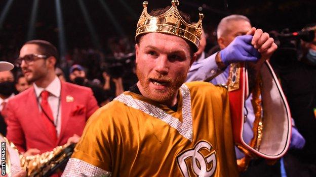 Saul Alvarez celebrates becoming the undisputed world super-middleweight champion