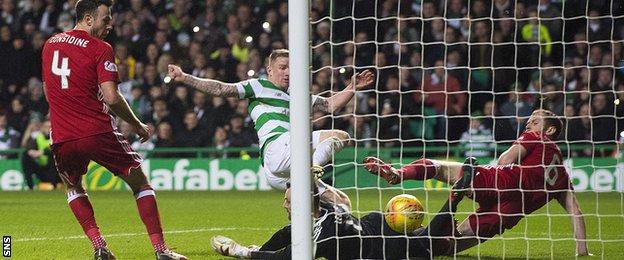 Jonny Hayes stretches to score for Celtic against Aberdeen