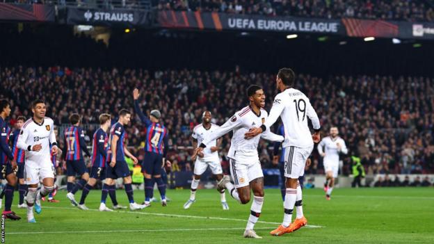 Manchester United players celebrate their second goal at Barcelona