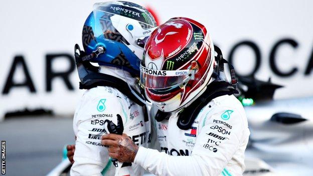 Valtteri Bottas and Lewis Hamilton hug after qualifying