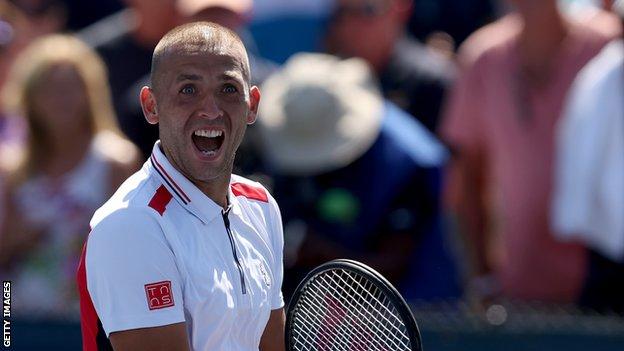 Dan Evans celebrates beating James Duckworth at the US Open