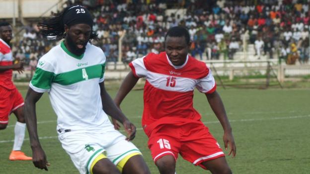 Emmanuel Adebayor (left)