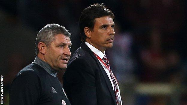 Osian Roberts and Chris Coleman watch Wales against Moldova in September, 2016
