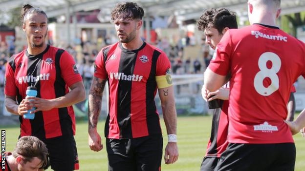 Stacey Freeman (centre) wears a white band around his wrist in memory of friend Connor Saunders