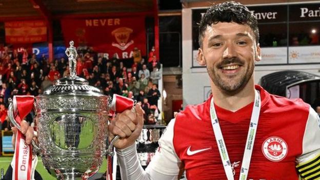 Larne captain Tomas Cosgrove with the Irish Cup