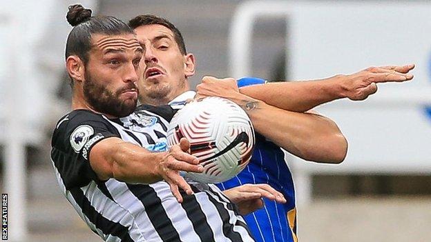 Andy Carroll in action for Newcastle against Brighton in the Premier League