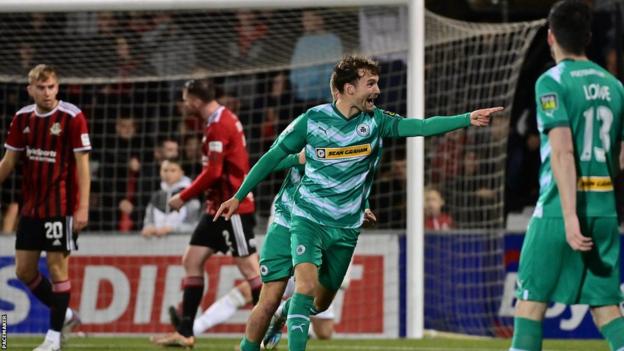 Ben Wilson celebrates scoring in Cliftonville's win over derby rivals Crusaders in September