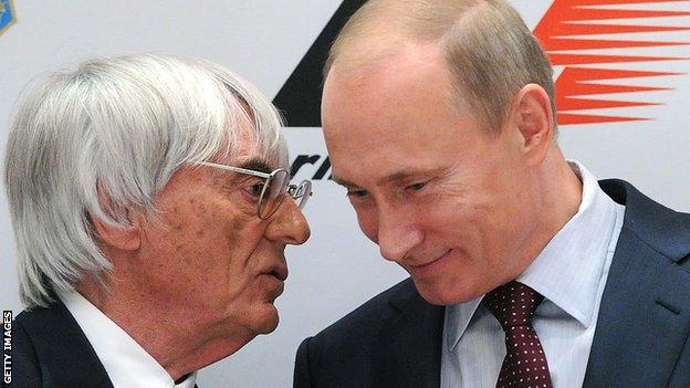 Russian Prime Minister Vladimir Putin (R) and Formula One racing director Bernie Ecclestone talk during a 2010 ceremony of signing an agreement to bring Formula One racing to Sochi for a Grand Prix Russia in 2014