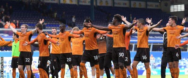 Wolves players celebrate in front of away fans at Birmingham
