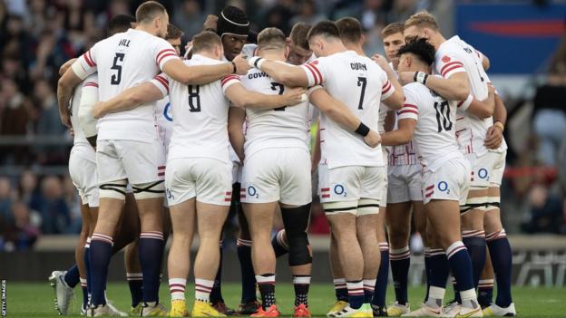 England players form a huddle
