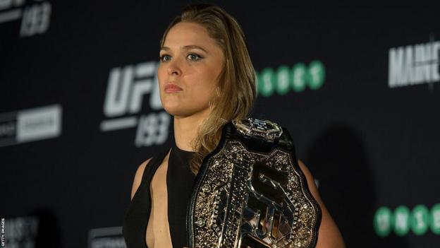 Ronda Rousey with the UFC title
