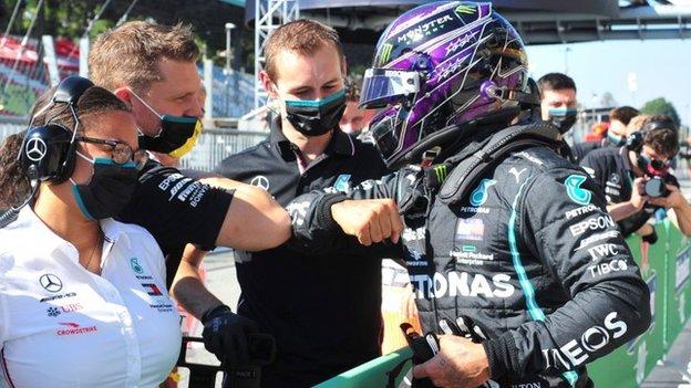 Lewis Hamilton celebrates with his Mercedes team after securing pole for the Italian Grand Prix